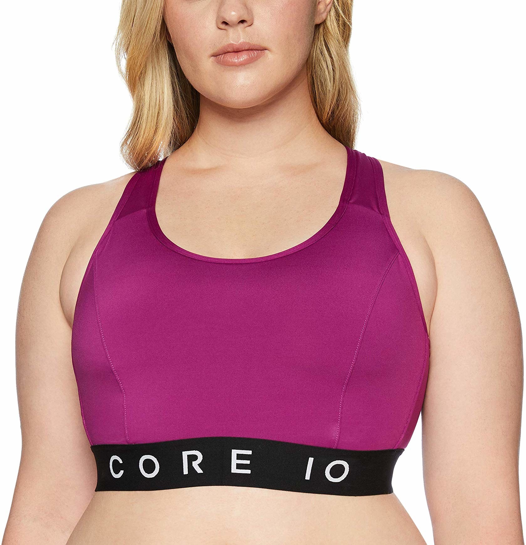 Model wearing the purple sports bra with black band that features the words CORE 10 