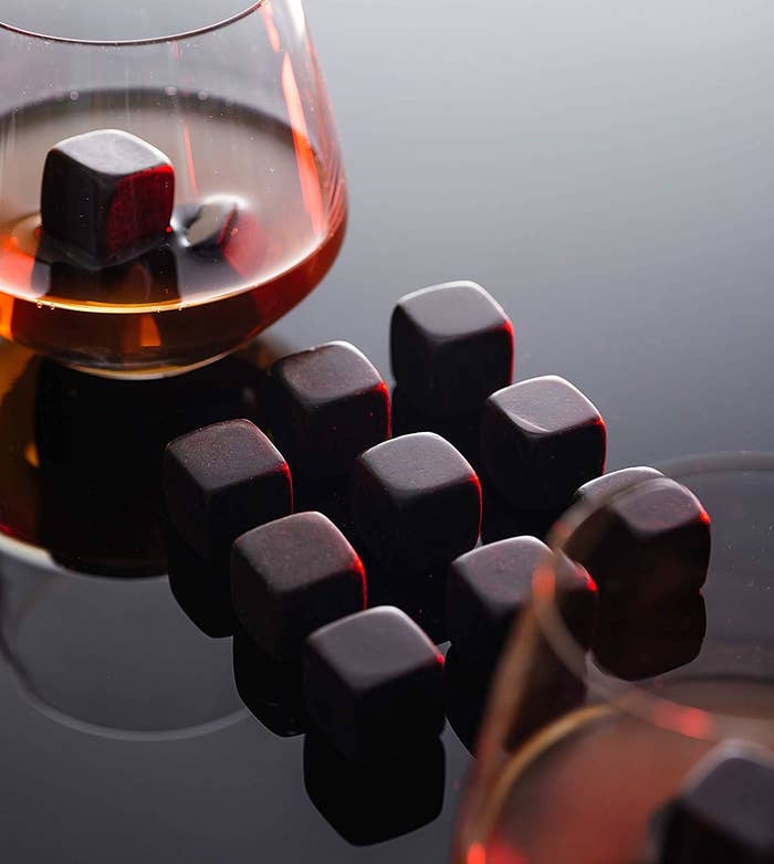 The black cubes next to a glass of whiskey