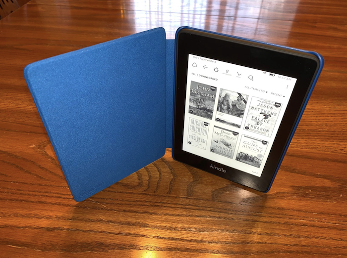 a kindle with a blue case