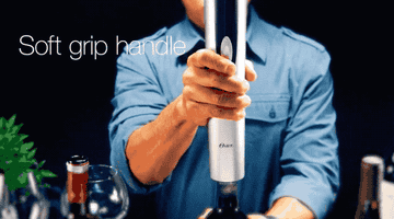 Gif of model using the Oster wine bottle opener to easily remove cork