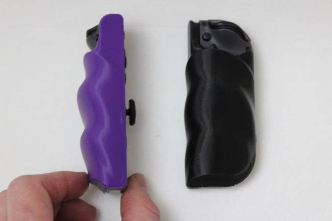 a purple and a black grip for the nintendo joycons