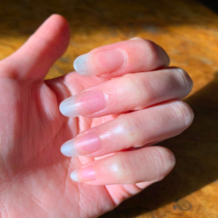reviewer's long healthy looking nails and cuticles