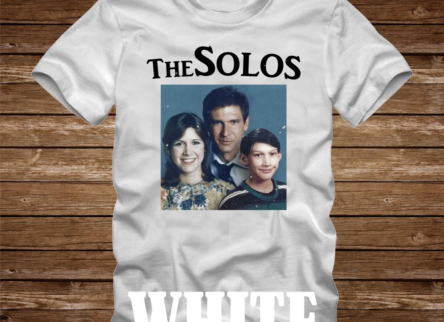 a white tee with a family photo of the solo family
