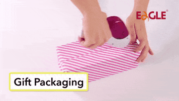A gif of the gun-like dispenser placing tape on a gift package