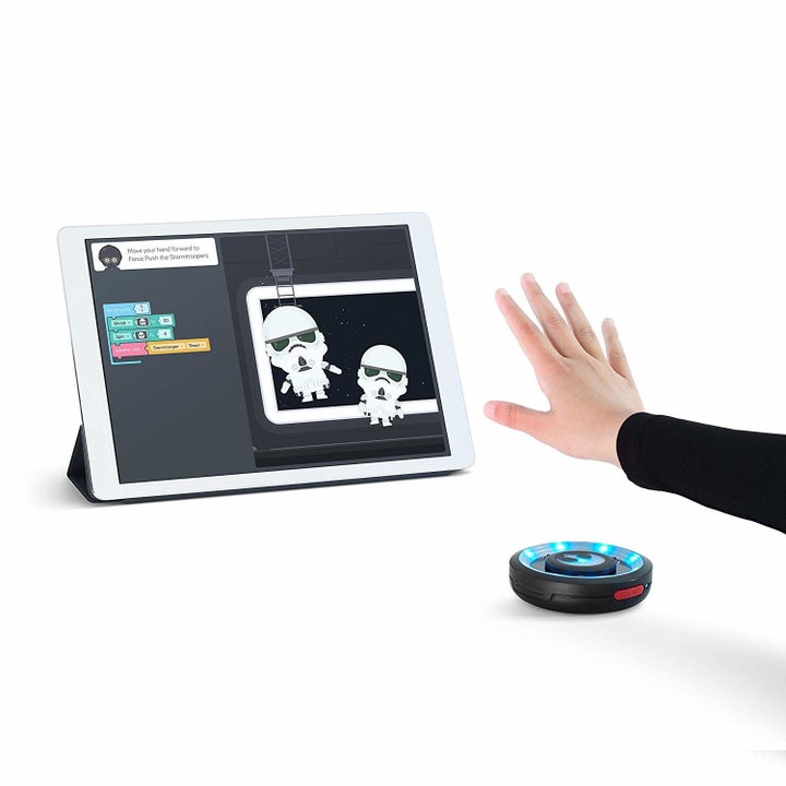 A hand controlling images on a screen