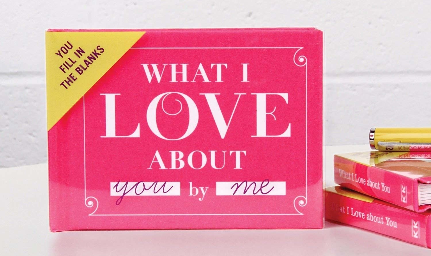 Small pink book called &quot;What I Love About You by Me&quot; and the message &quot;You fill in the blanks&quot; in the upper-left corner.  