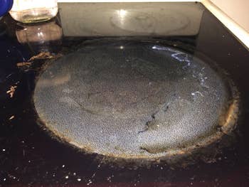 A dirty cooktop before using the cleaner kit