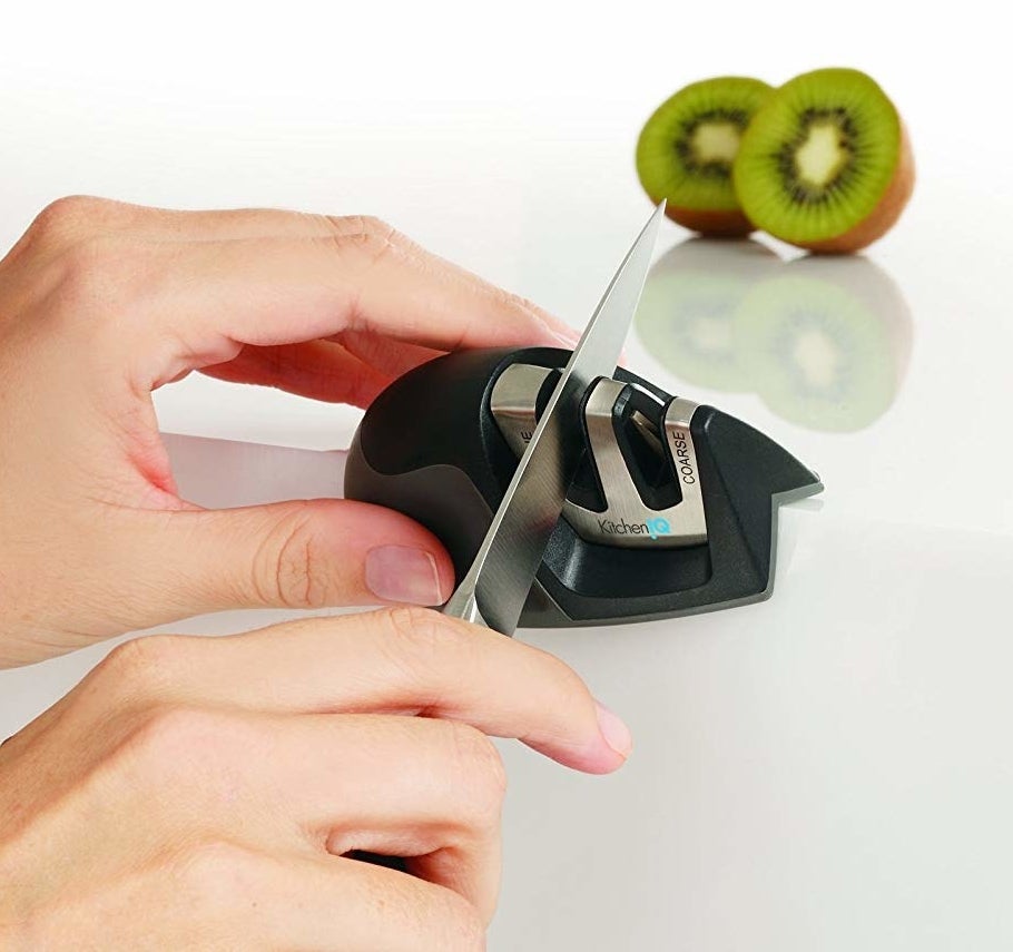 A model using the sharpener on the edge of a counter