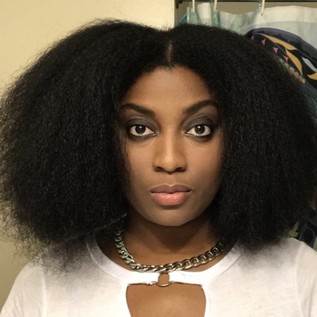 A woman with a shoulder-length afro.