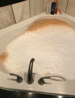 tub with lots of foaming dirt in it