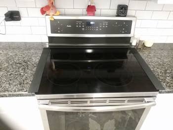 a pair of black gap covers on either side of a stove