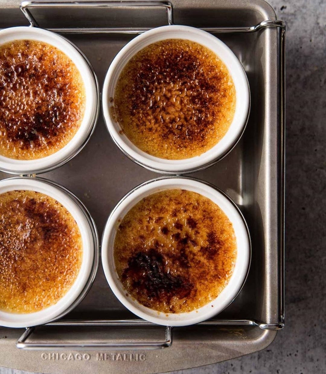 four crème brûlées in the pan