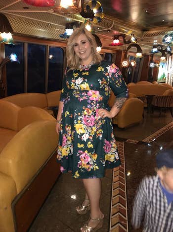 Reviewer wearing floral dress