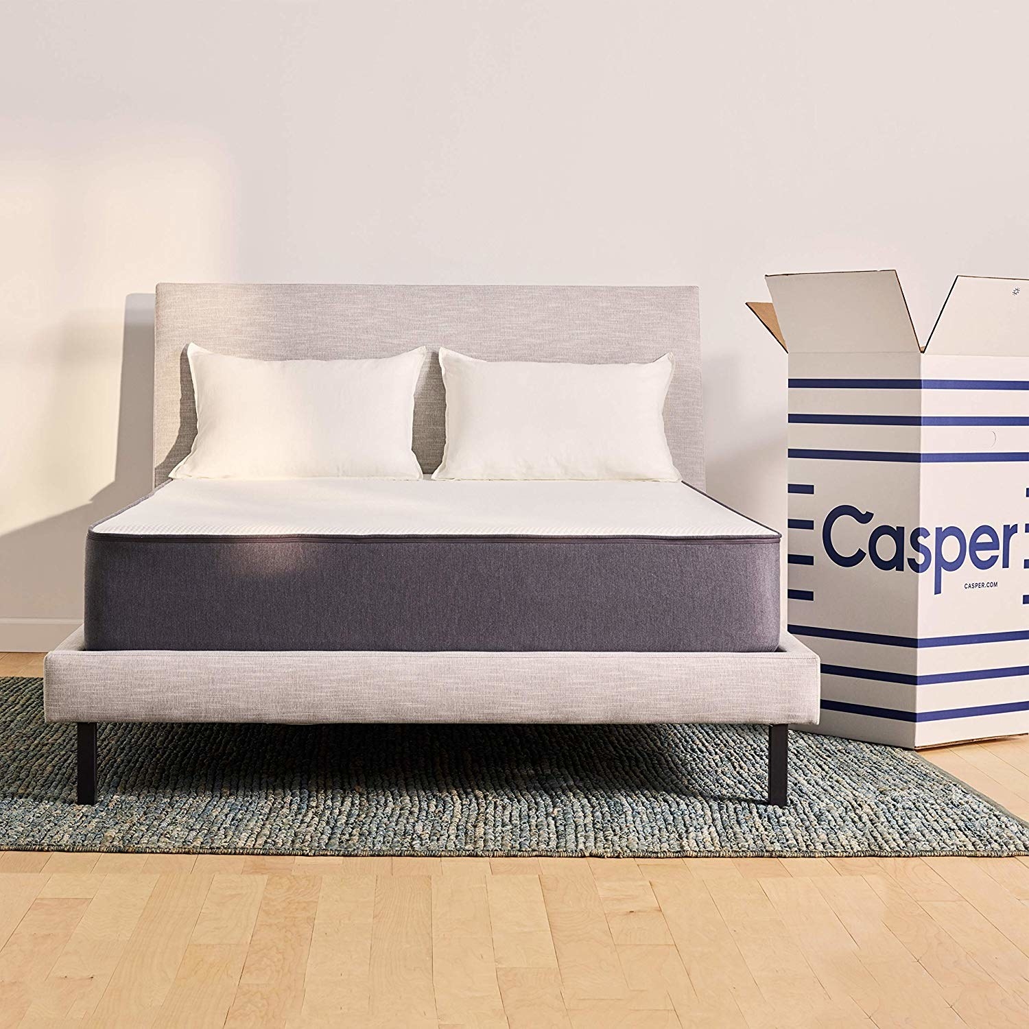 Casper mattress uncovered on bed frame 