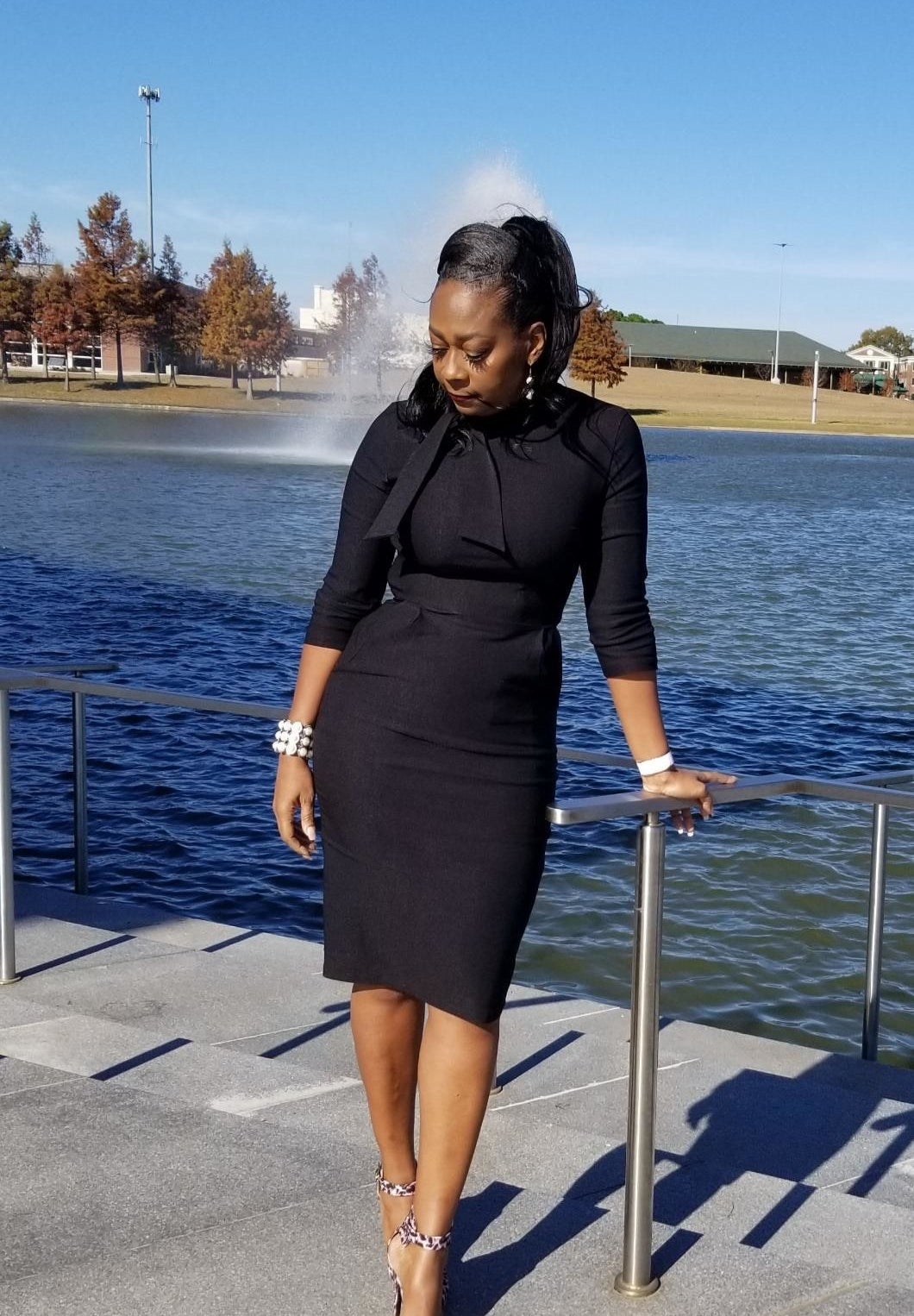 Reviewer wearing the three-quarter sleeve dress in black