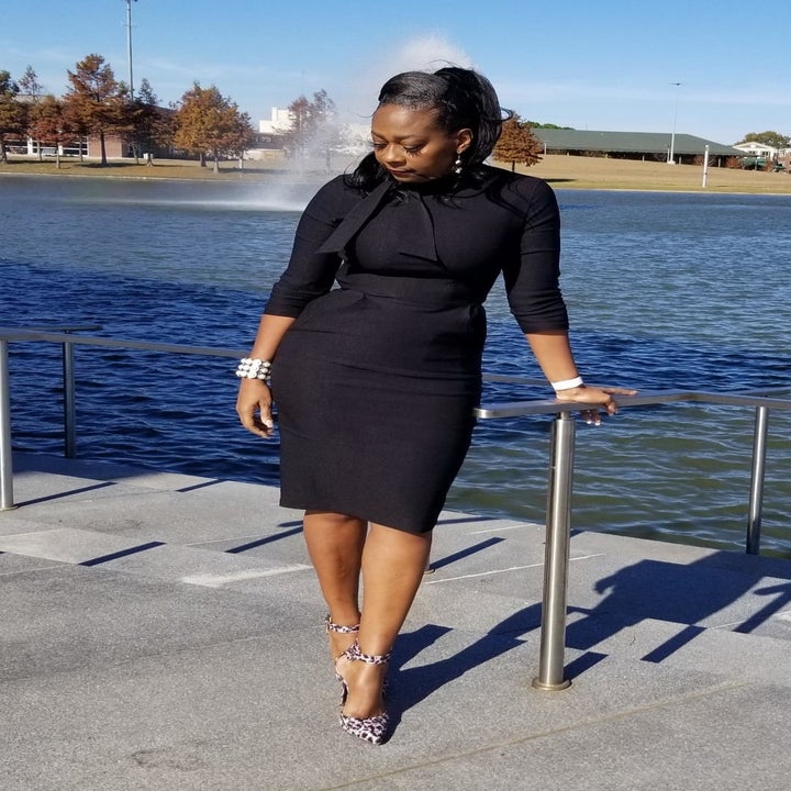 Reviewer wearing the three-quarter sleeve dress in black