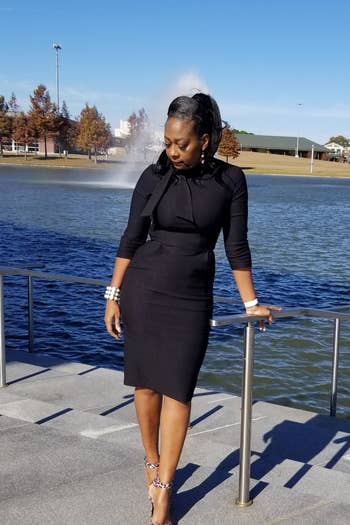 Reviewer wearing the three-quarter sleeve dress in black