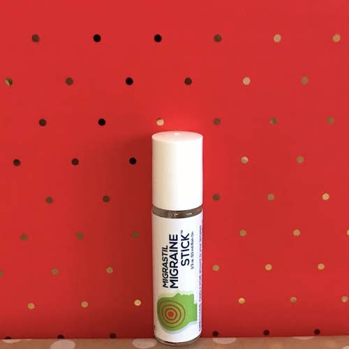 essential oil stick the size and shape of a Chapstick lip balm with a white top and a white label