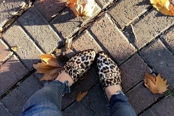 reviewer wearing leopard print loafers