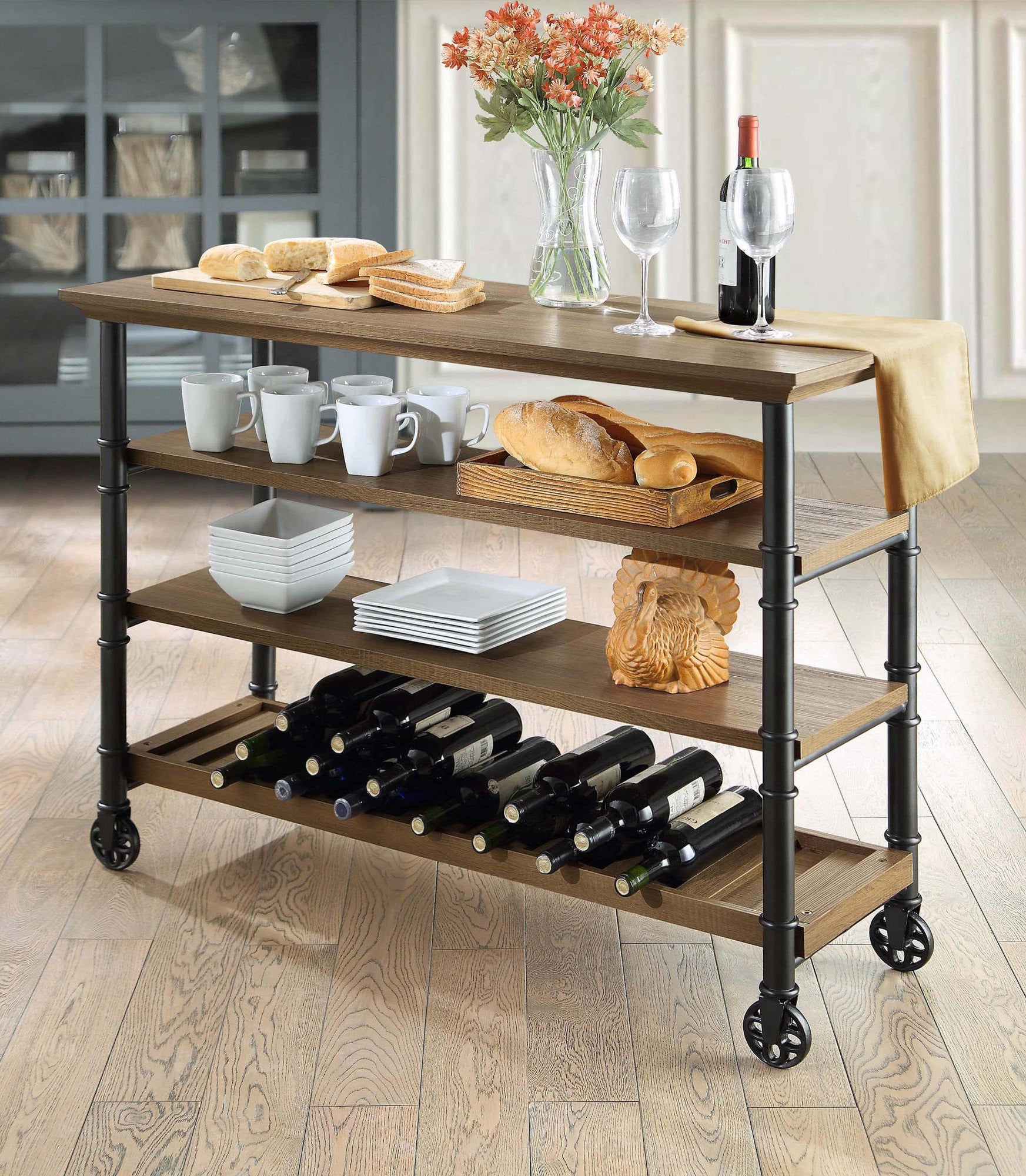 the wheeled cart with wine and dishes