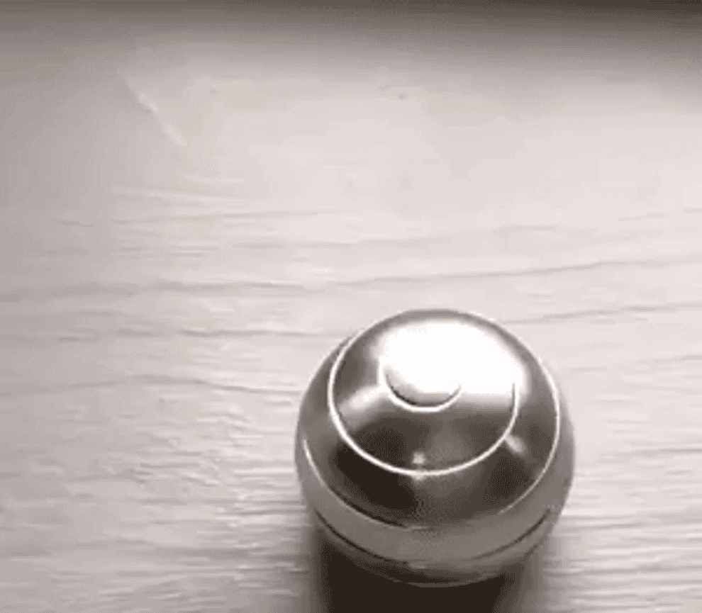 a moving gif of the optical illusion spinner ball