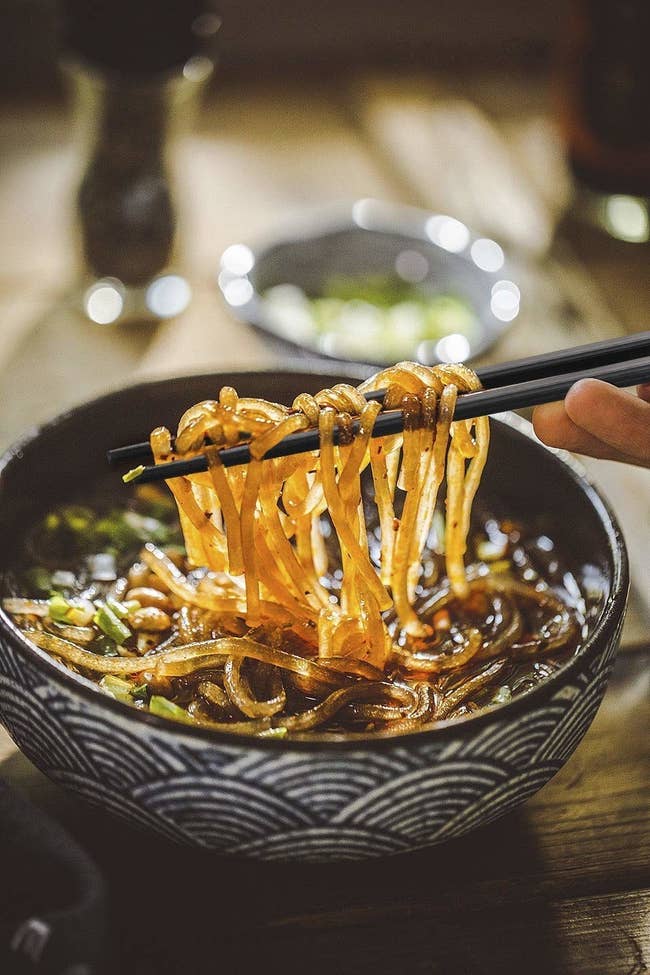 Glass noodles held up with chop sticks