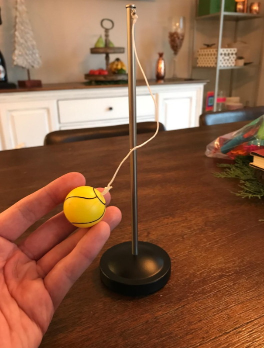 a reviewer playing with the desktop tether ball game