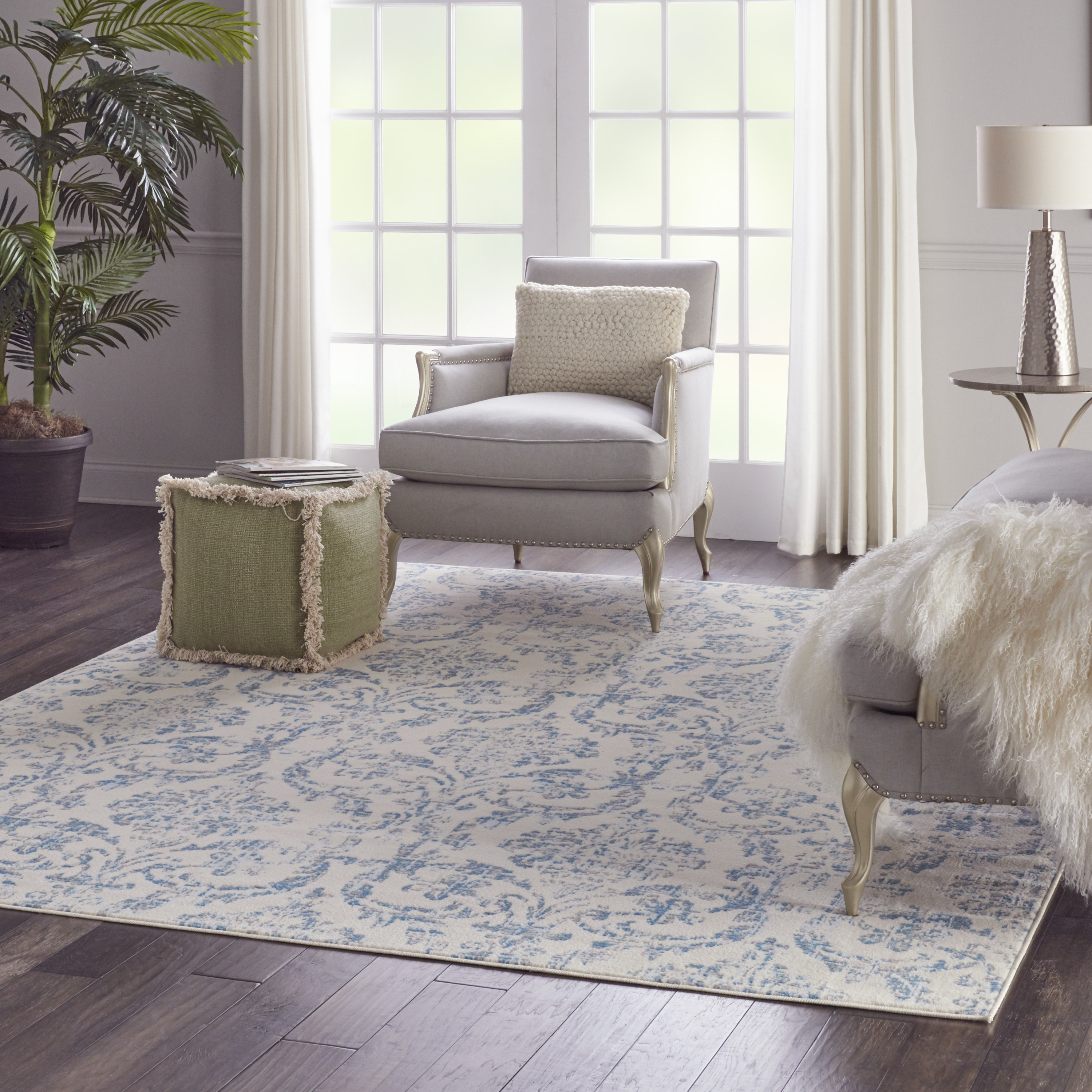 a blue and white rug in a living room setting