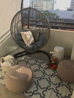 reviewer's pic of patio with the rug on it