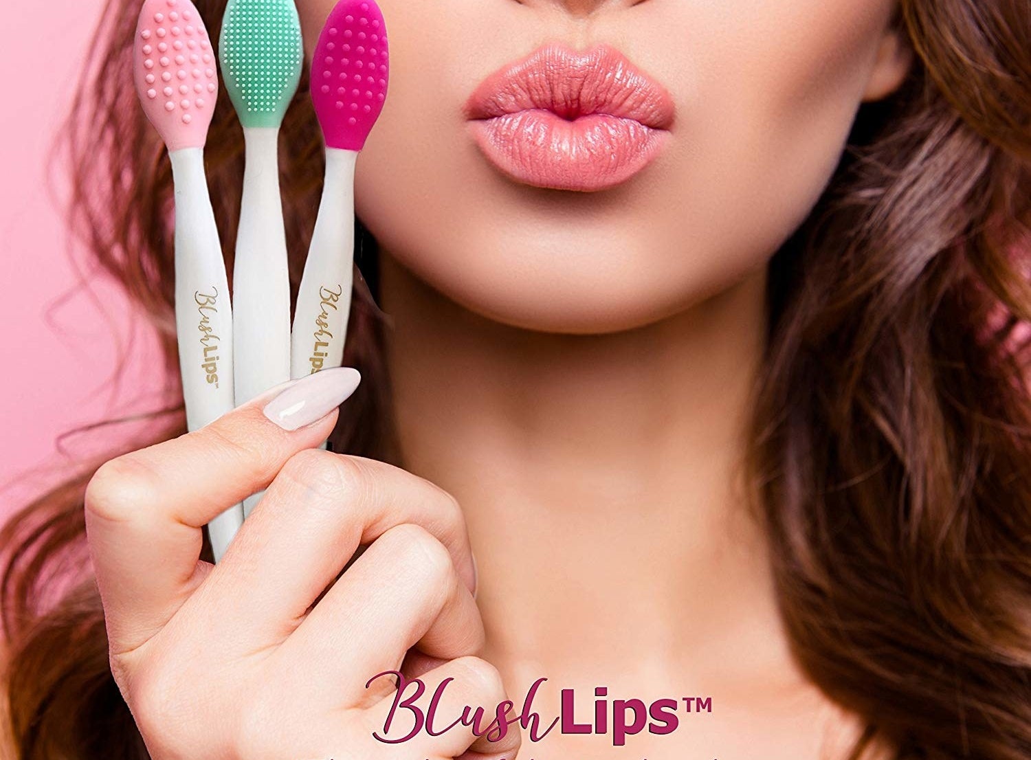 a model holding up the lip brushes in three colors