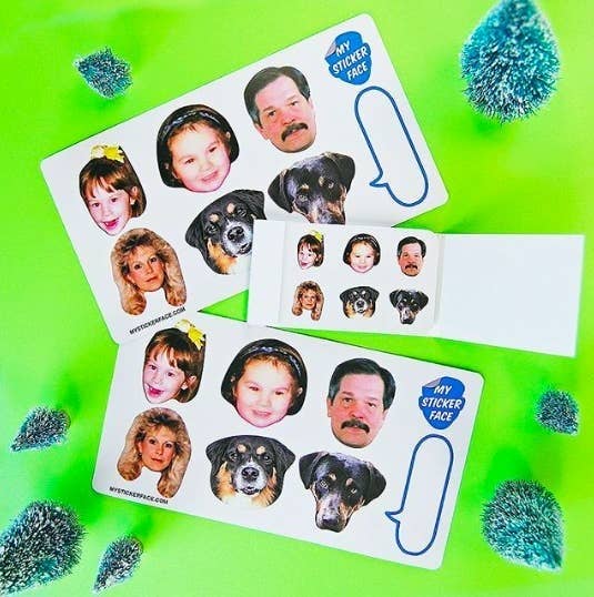 sticker sheets with cut-outs of peoples and dogs faces