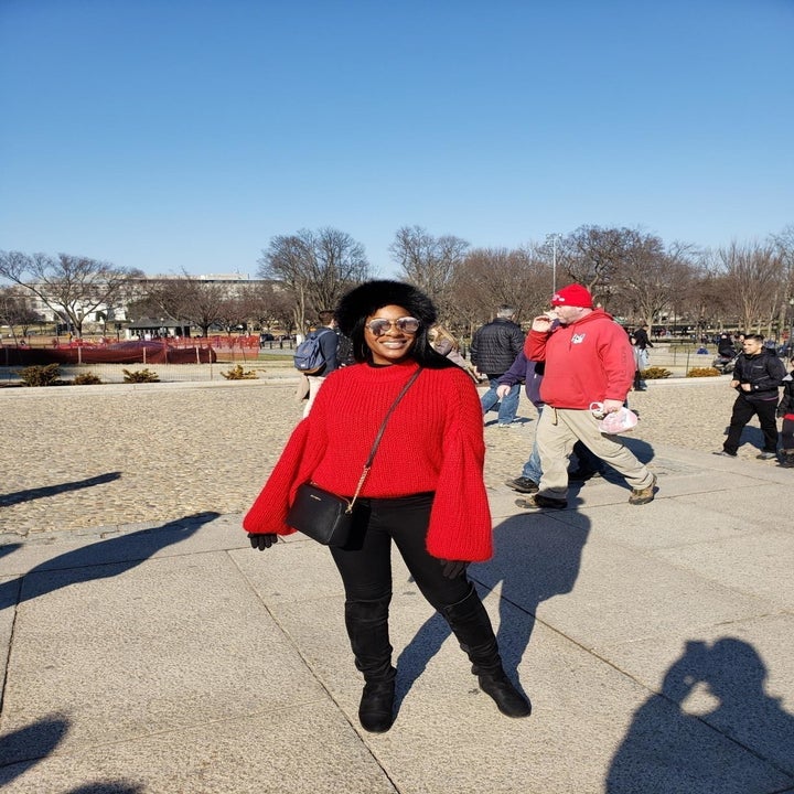 Reviewer wearing the sweater in red