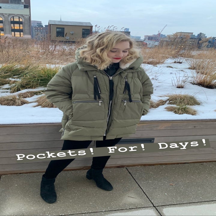 Maitland wearing the coat with text "pockets for days" 