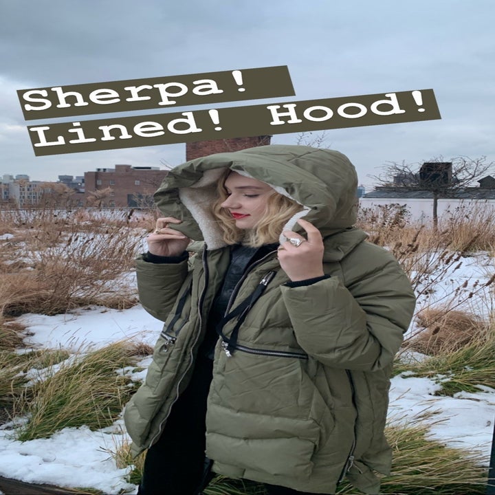 BuzzFeed Senior Editor wearing the olive green coat with text "sherpa! lined! hoodie!" 