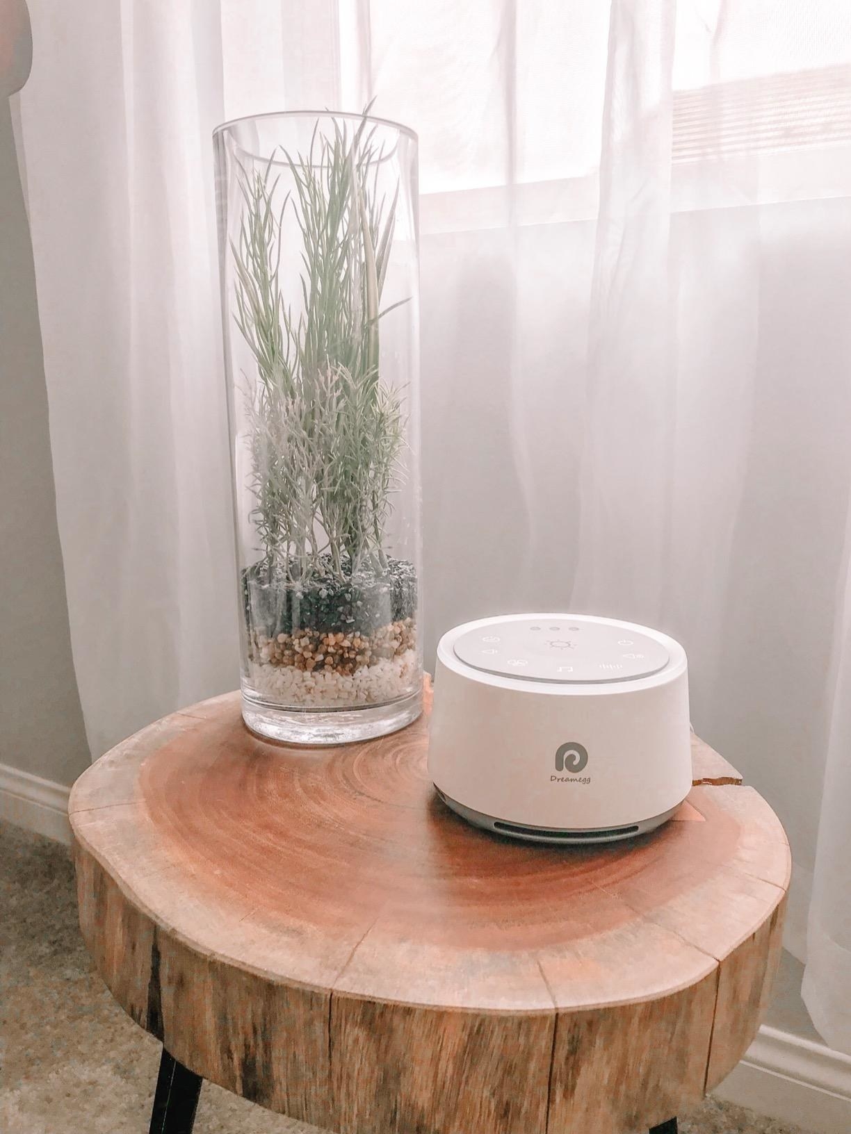 the sound machine in white on a tabletop 