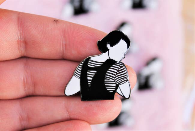 The black and white pin that looks like Fleabag turning looking over her shoulder