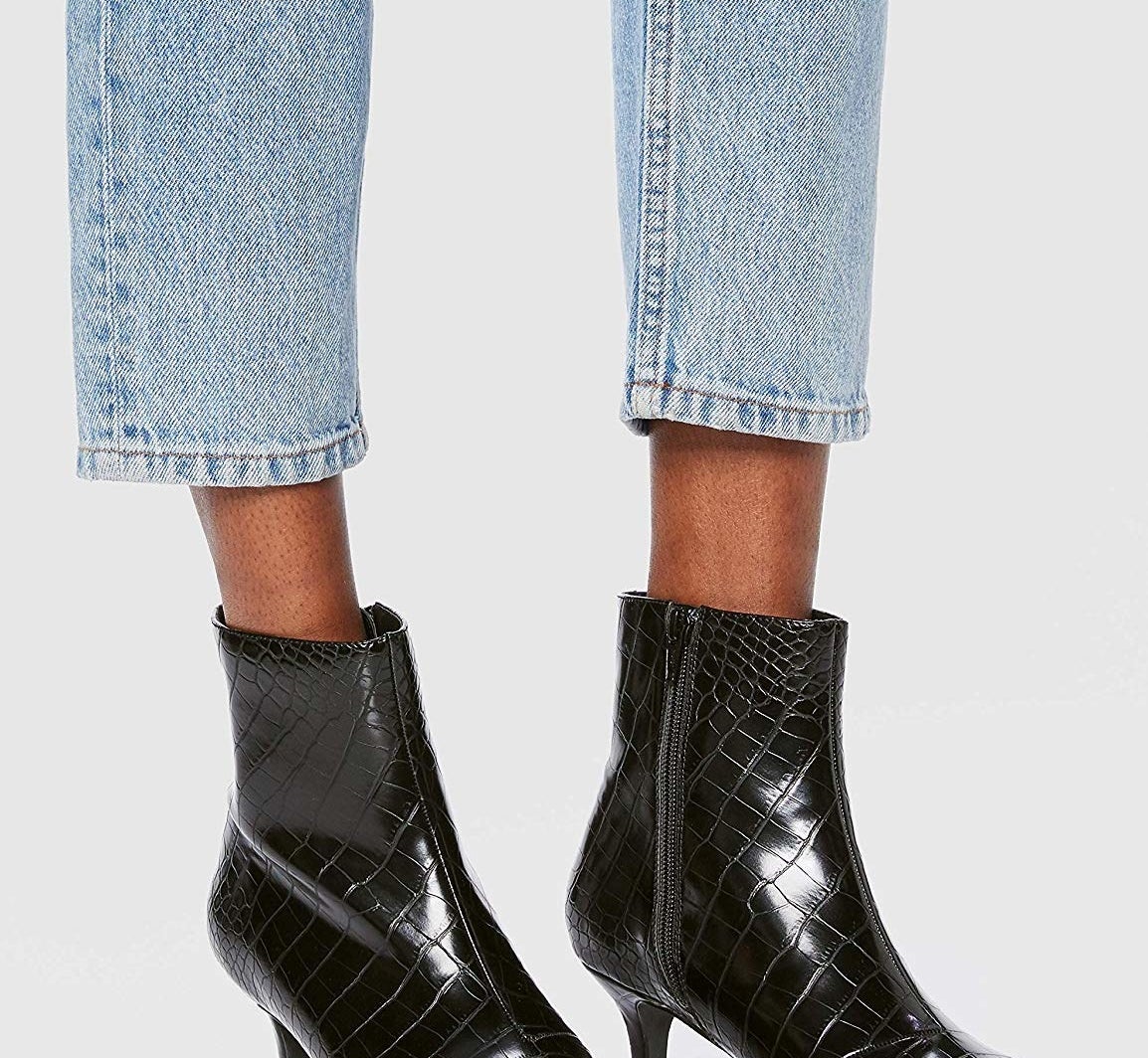 model wearing the black boot kitten heels with side zipper