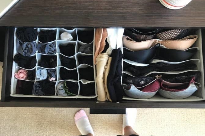 Reviewer showing their organized drawers with socks and bras in individual slots 