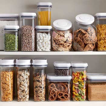 A shelf organized neatly with multiple sizes of the containers 