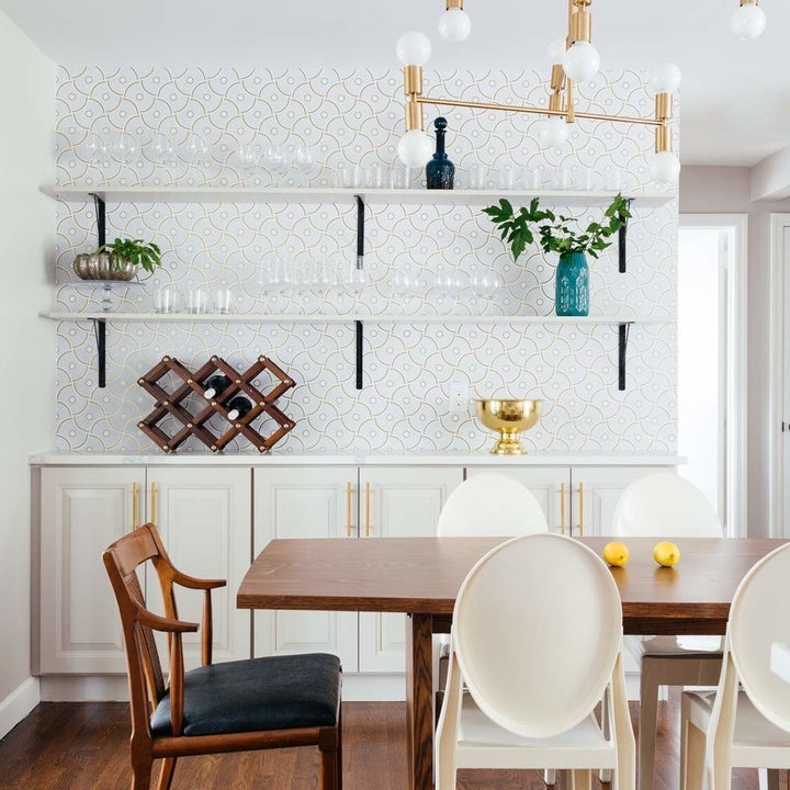 a kitchen wall covered in the light-tone paper