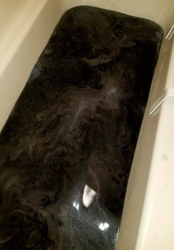 bath tub with black water