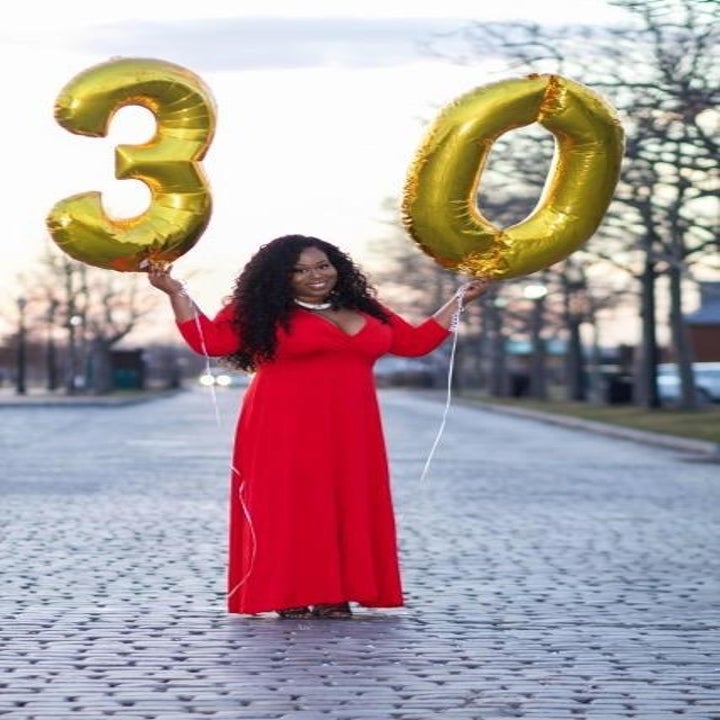 reviewer wears dress in red 