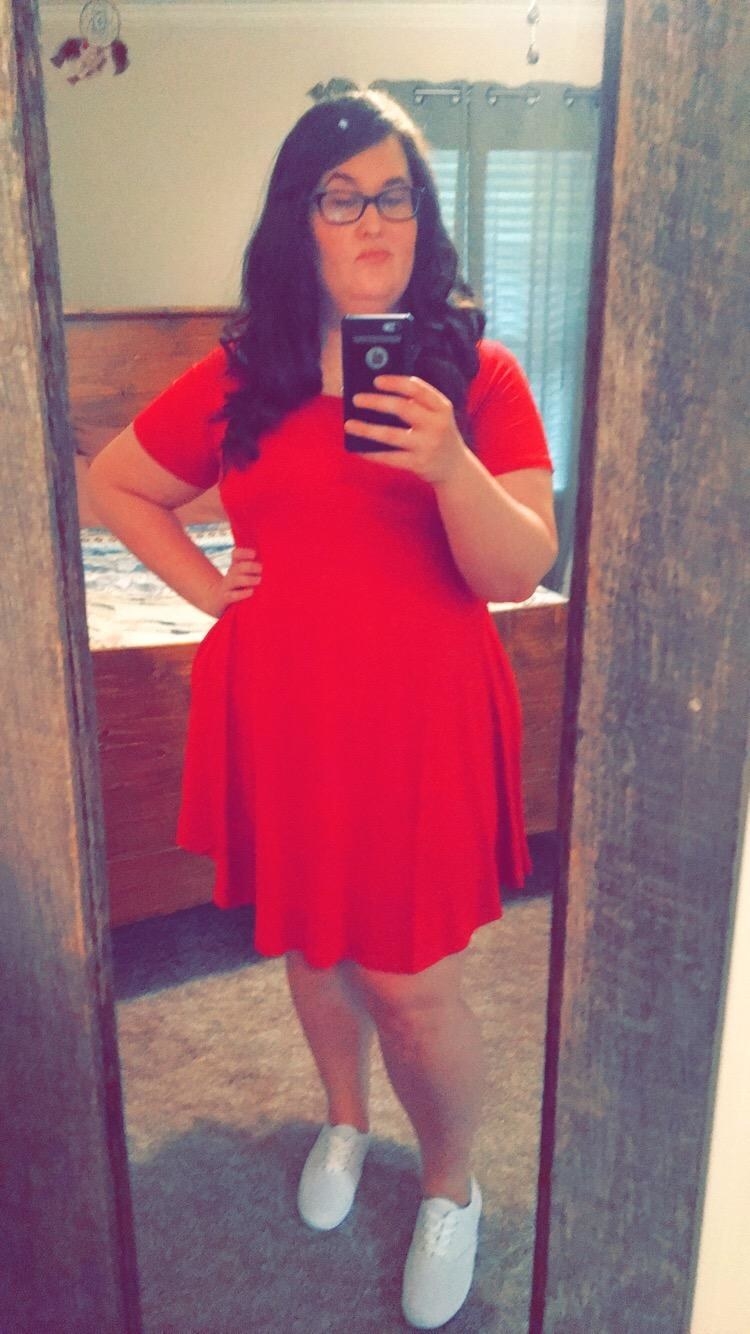 reviewer wears red dress