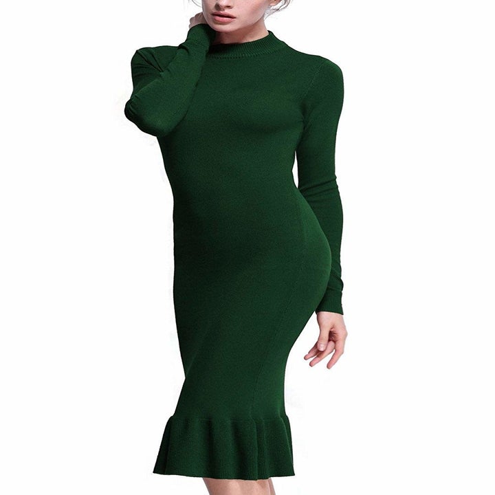 model wears tight high neck dress with flare bottom 