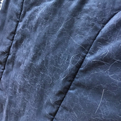 comforter covered in hair
