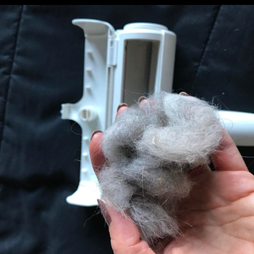 reviewer removing huge clump of hair from roller