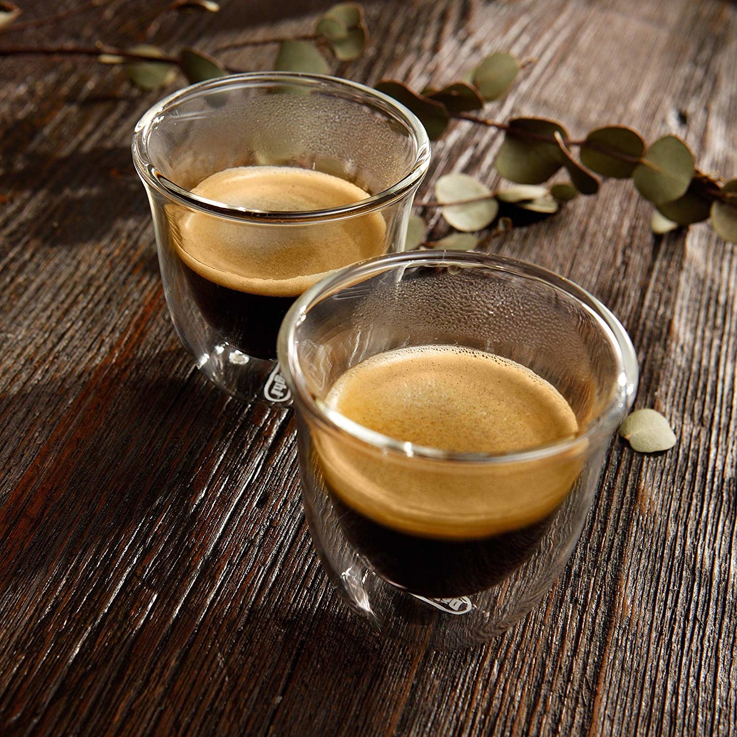 A pair of espresso glasses on a table