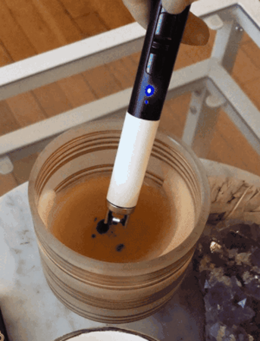 a gif of the buzzfeed editor using the lighter to light a candle