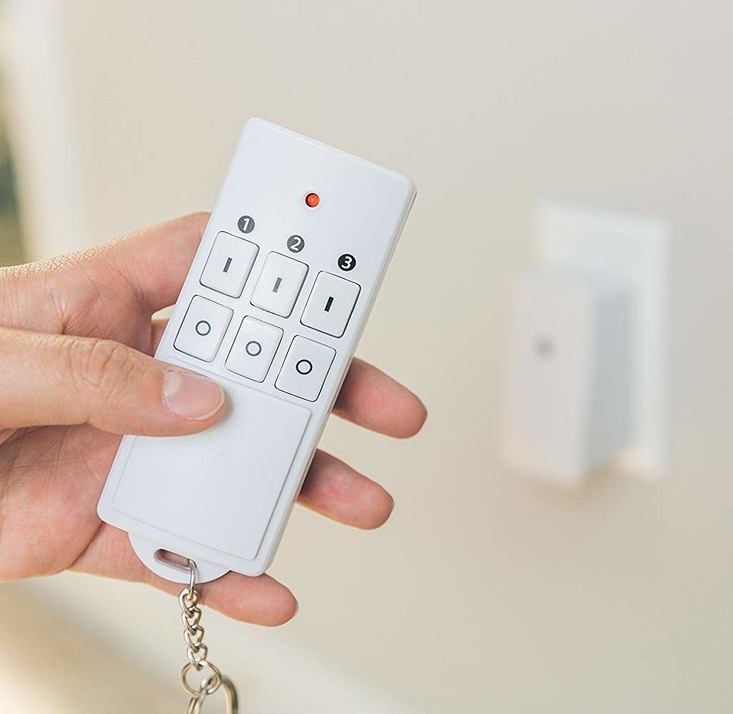 a model holding the white remote