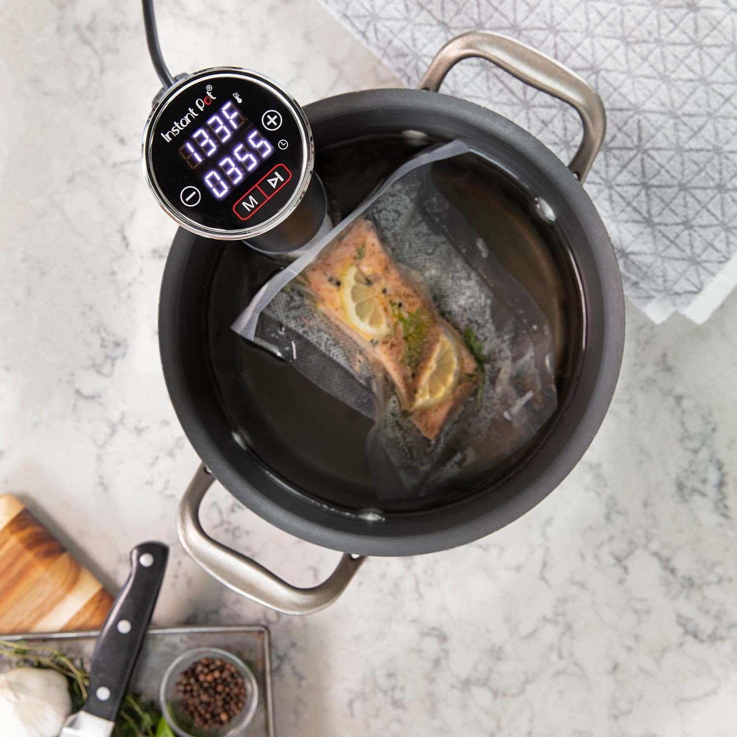 The sous vide cooker, featuring a digital display